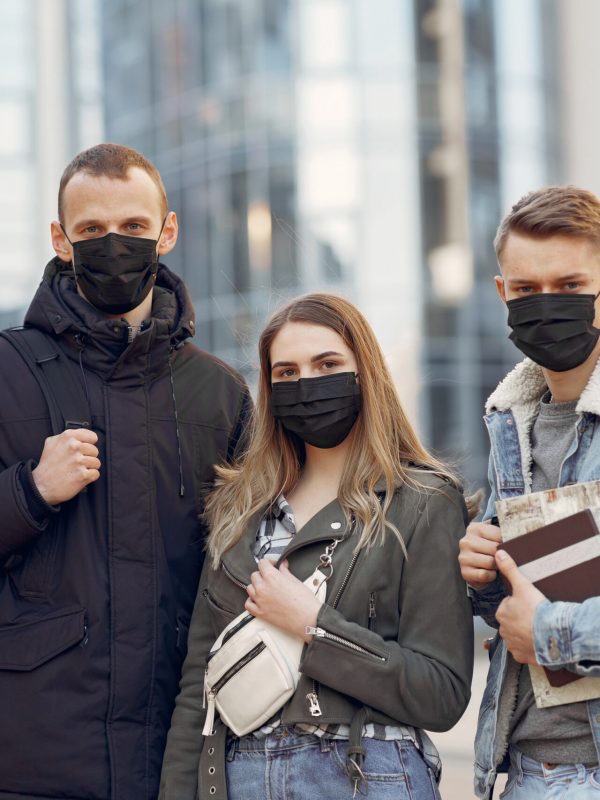 People in the city. Persons in a masks. Coronavirus theme. Friends walks during quarantine.